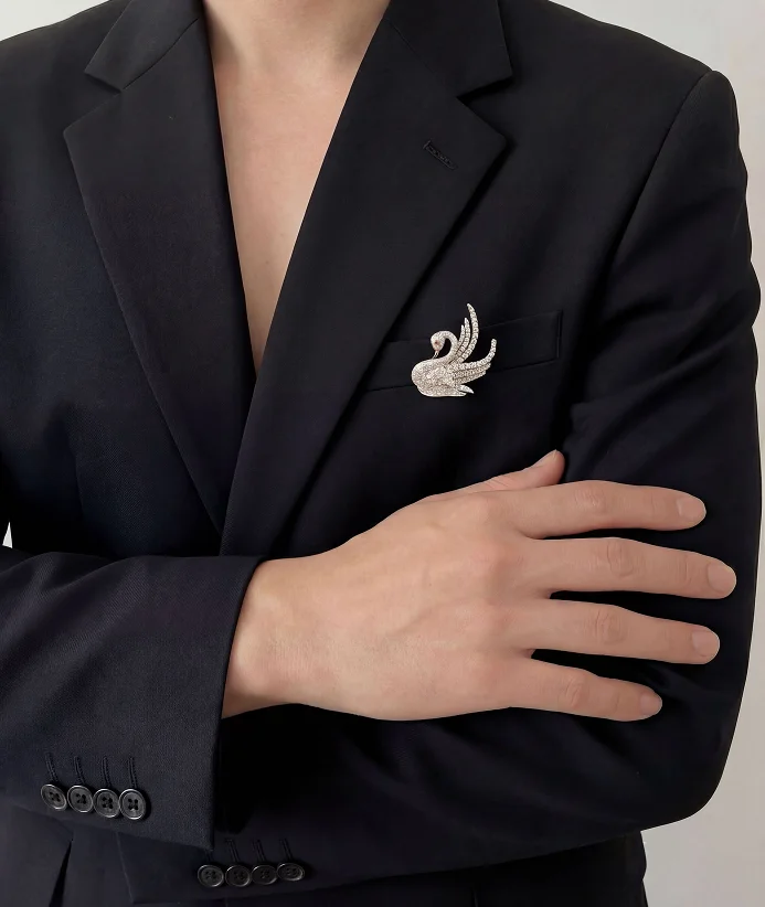 Swan diamond brooch blazer look